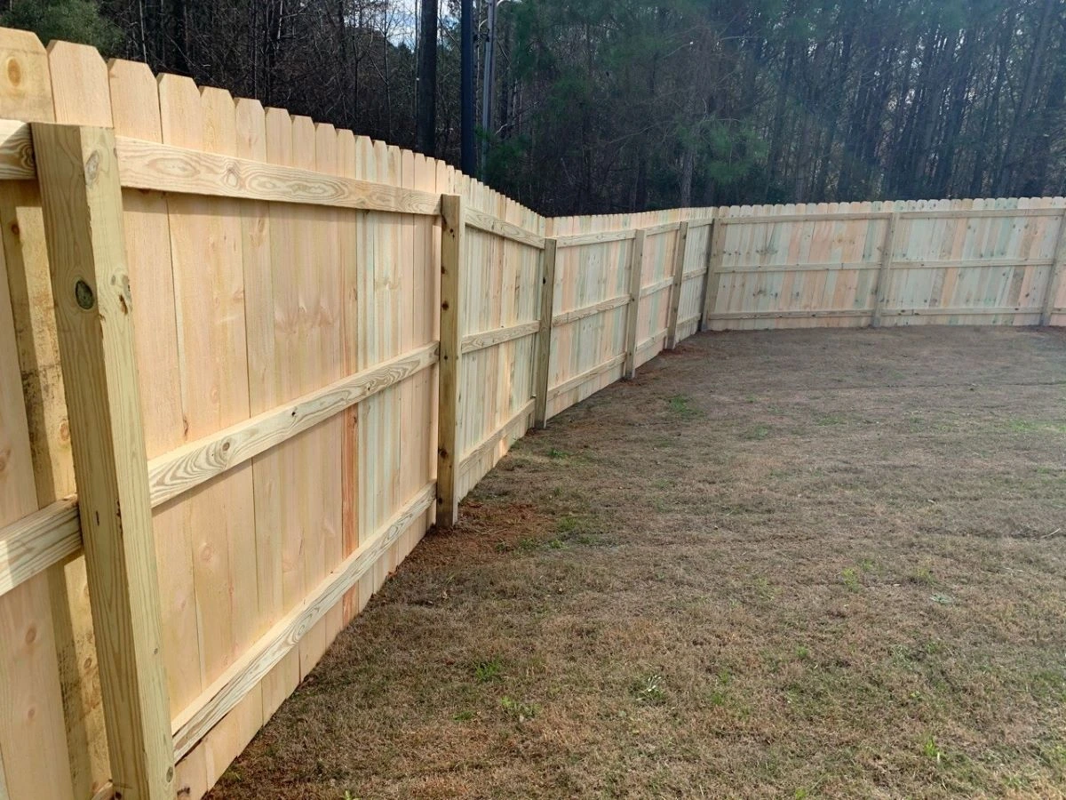 Fence stepped across sloped yard