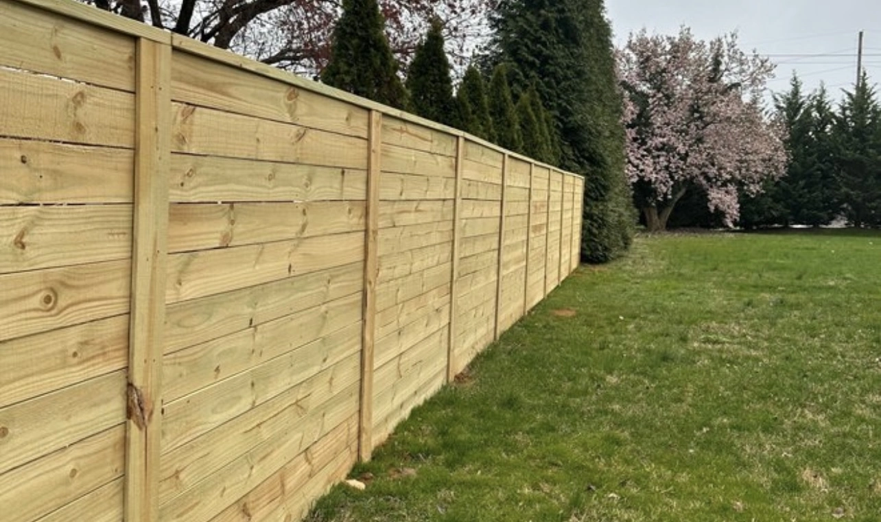 Three-rail ranch style wood fence