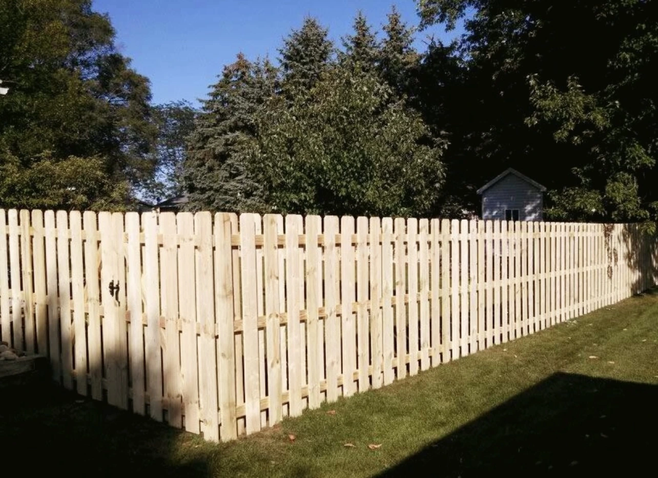Shadowbox picket fence with corner gate