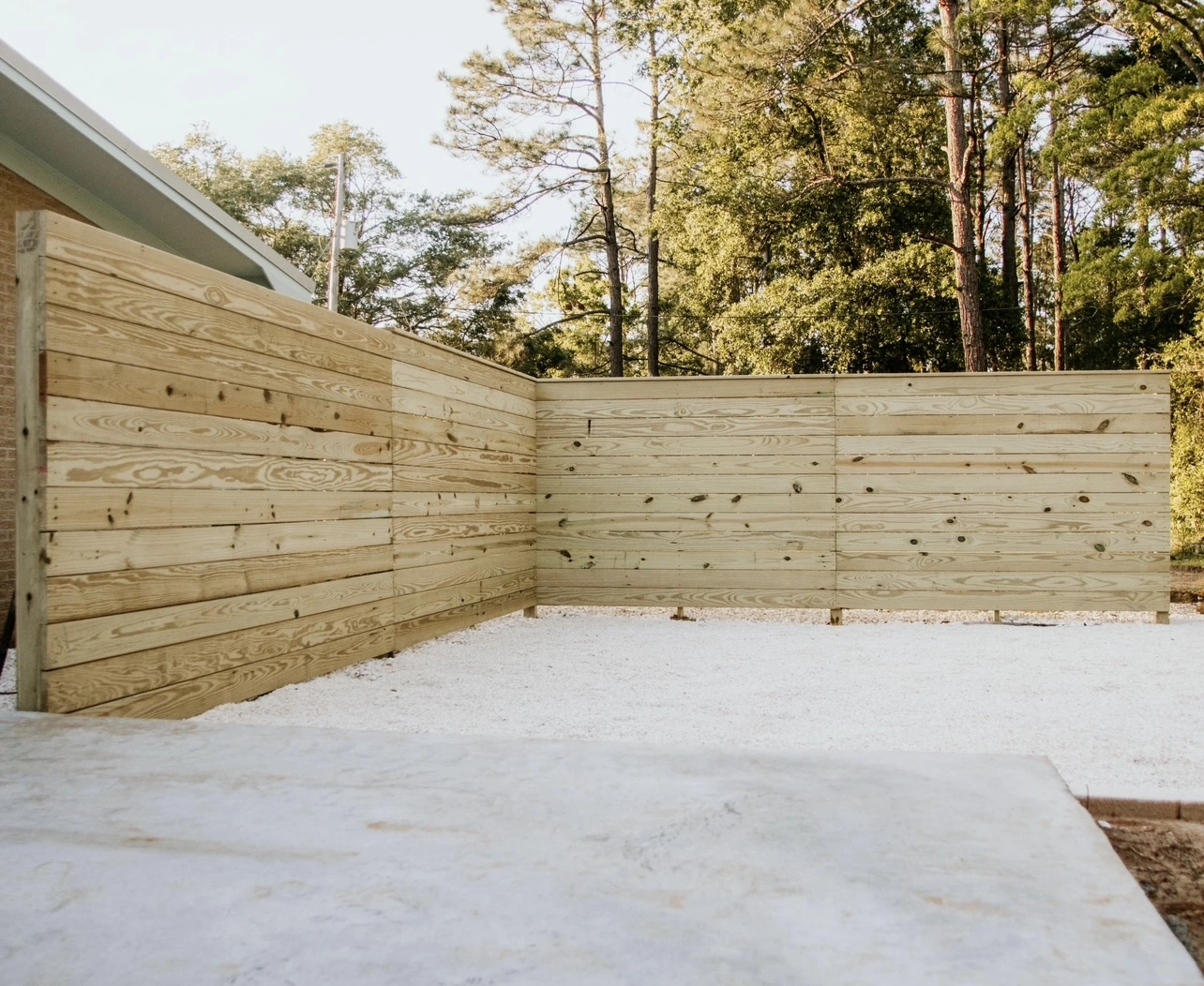 Horizontal privacy fence in pressure-treated pine with straight, clean lines in Molino, FL