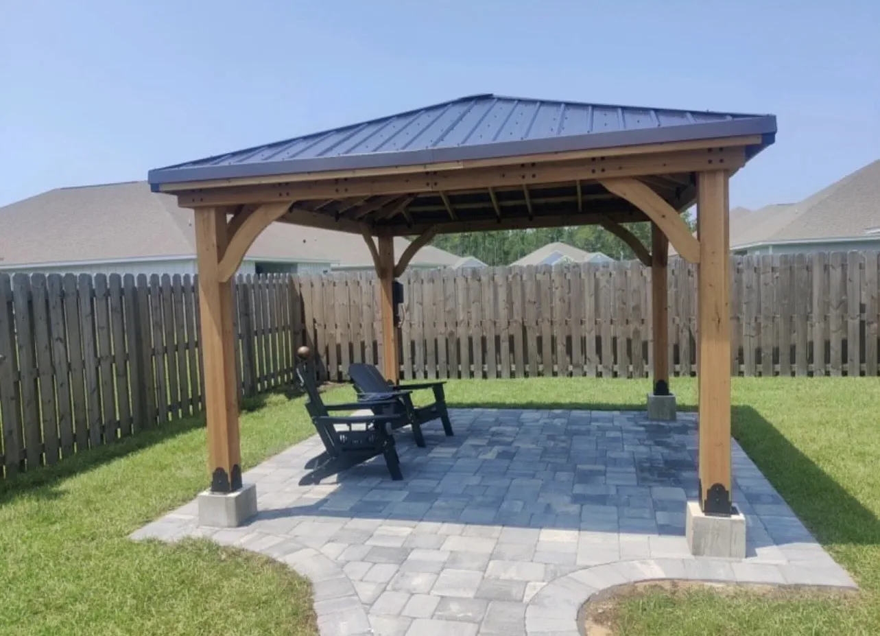 Timber pavilion sitting on paver patio